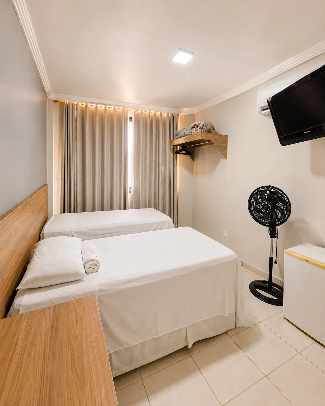 Suíte com ar-condicionado do Hotel Carreiro, hotel em Inhapim MG